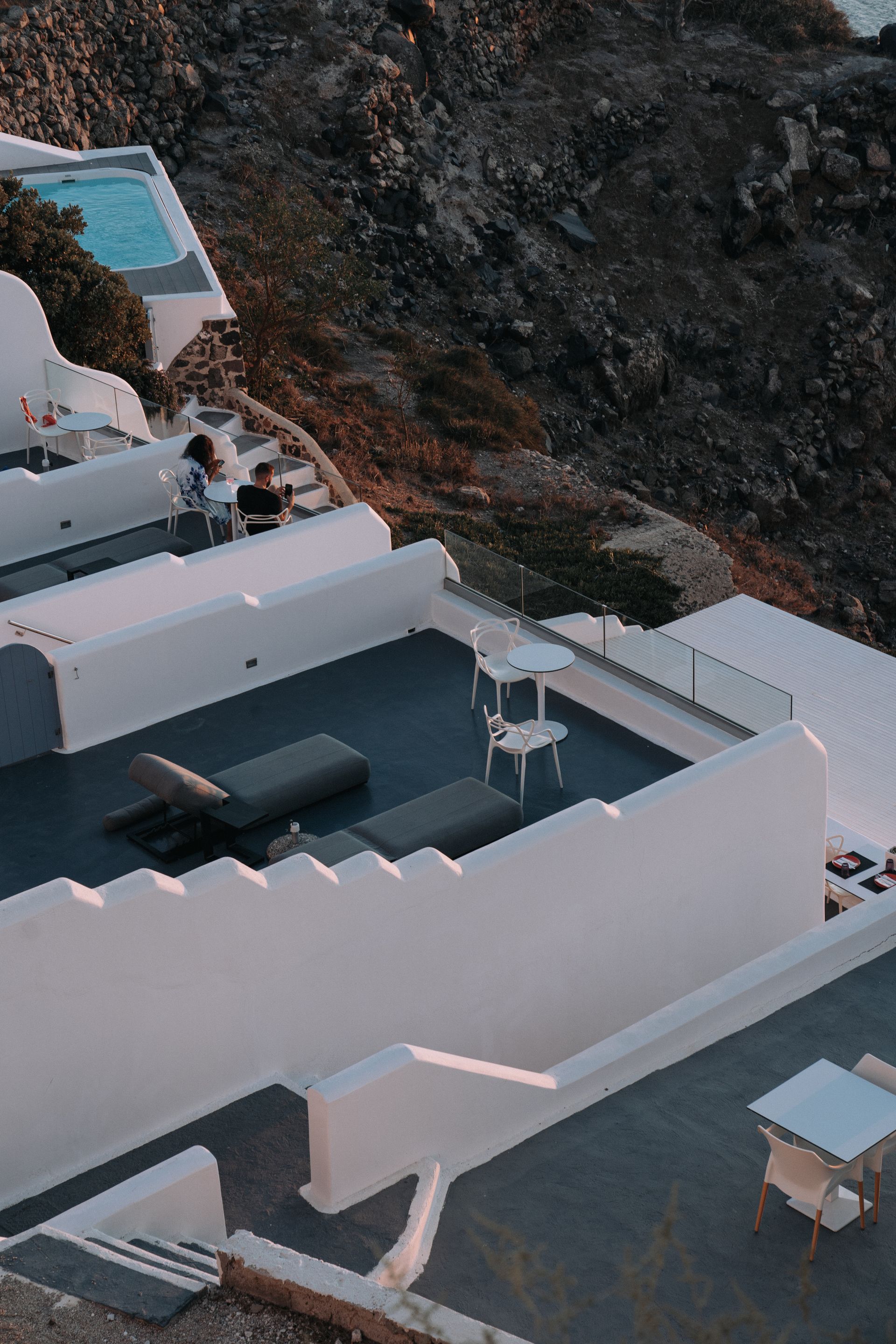 Resort terrace and pool deck in low evening light